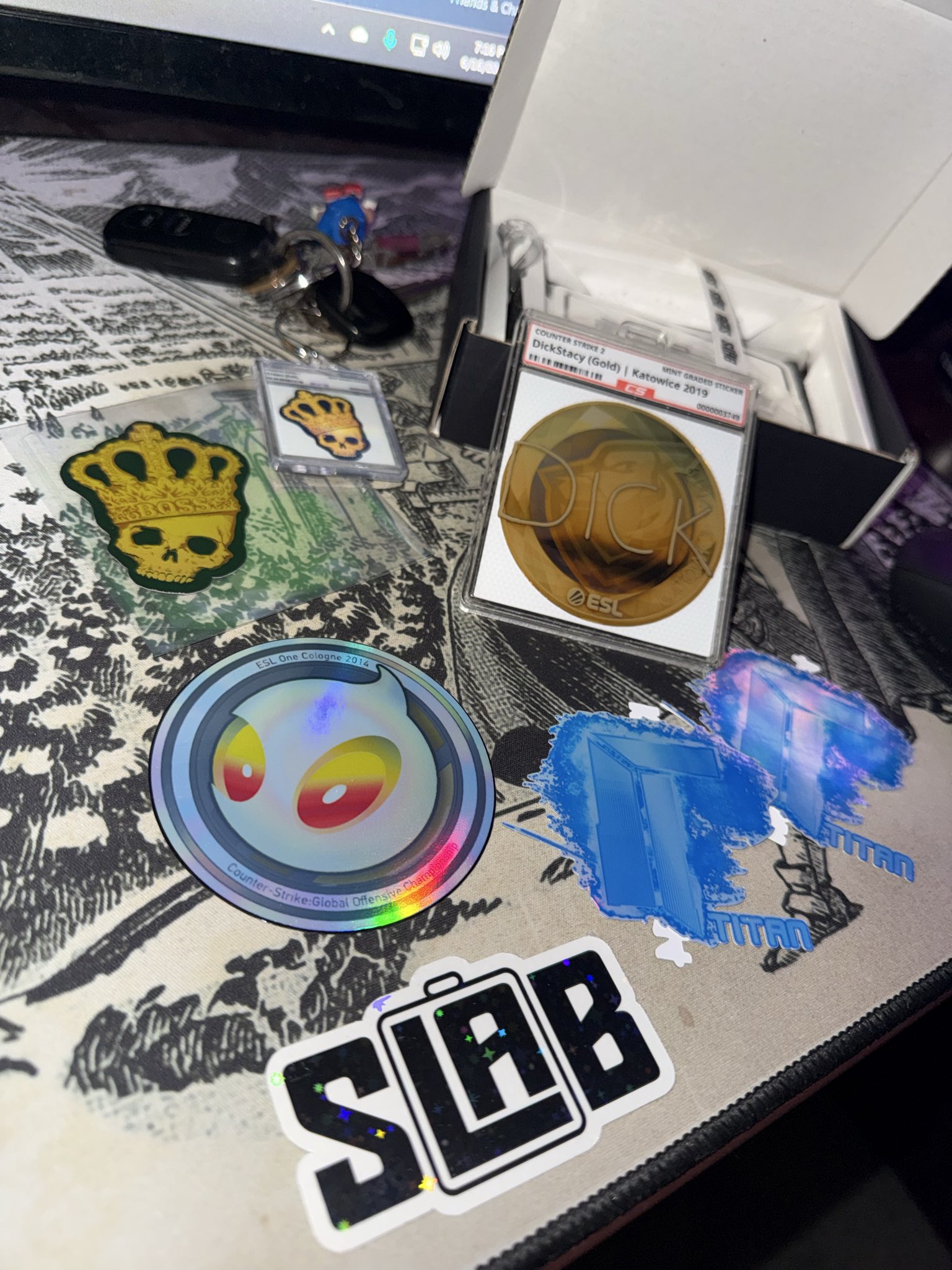 Various stickers, keychain and DickStacy Slab